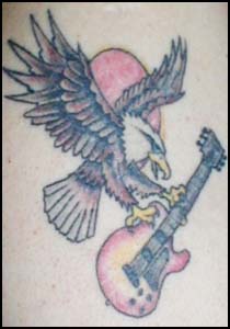 Terrible Tattoo Eagle Carrying A Guitar