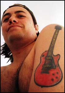 Awful Guitar Tattoo on Shoulder