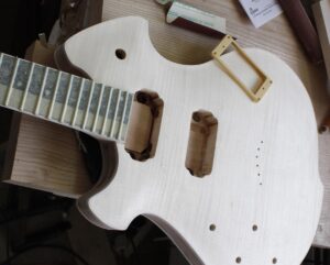 Testing the fit of the guitar neck