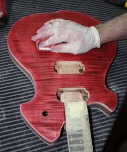 Close up of the guitar body being stained