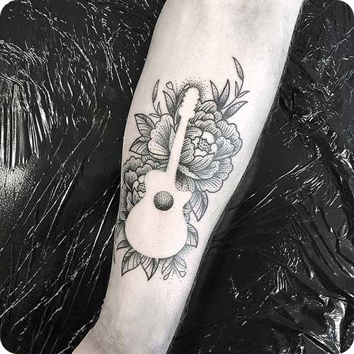 Negative Space Guitar Tattoo