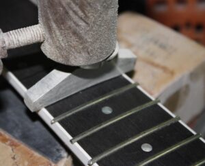 Inserting the guitar frets