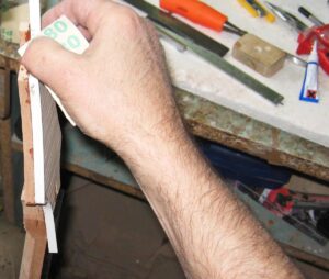 Applying binding to the guitar headstock